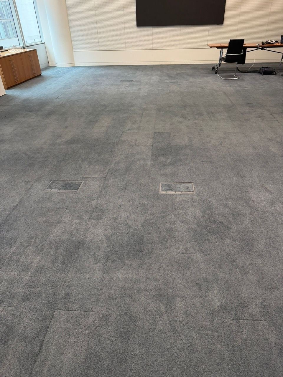 Meeting Room carpet tiles before being fixed - Loughton Direct
