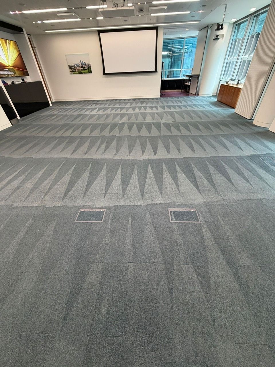 Restored meeting room carpet tiles after powerbrushing - Loughton Direct