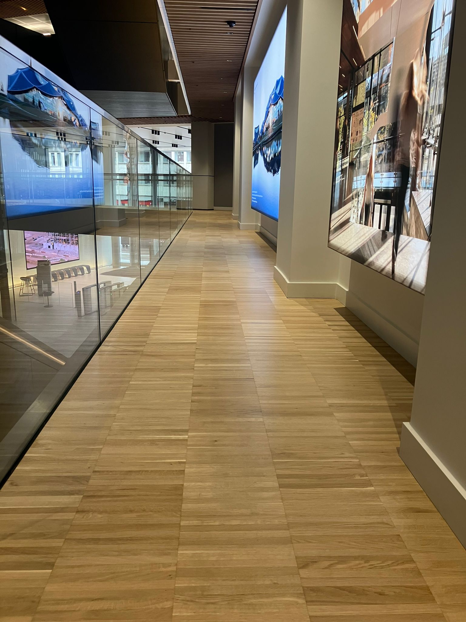 Loughton Direct - Restored parquet atrium flooring following sand and seal works