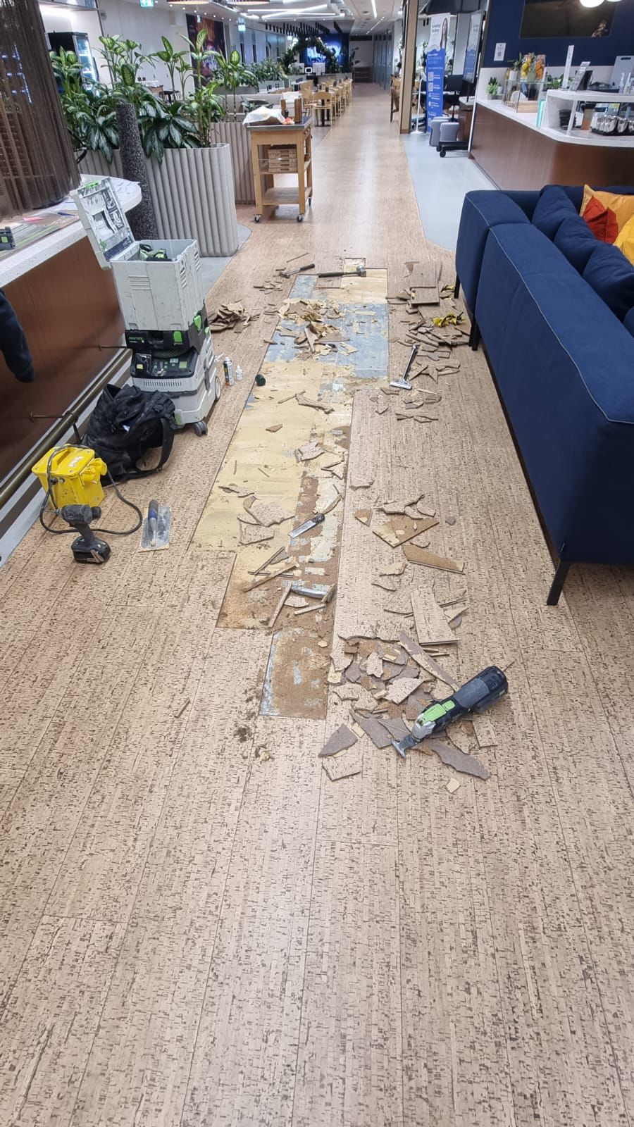 Damaged vinyl planks being lifted at tea point - Loughton Direct